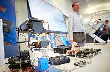 Exhibitors at ESE at their exhibition table